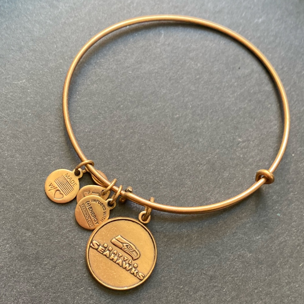 Alex and Ani gold toned bracelet with NFL Seattle Seahawks charm.